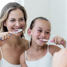 Mother and Daughter Learning How To Brush Teeth by East Ringwood Dental