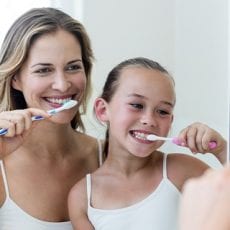 7 BEST DENTAL CARE TIPS AT HOME Mother and Daughter Learning How To Brush Teeth by East Ringwood Dental